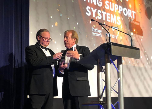 Ted Head - Receiving the award plaque for Environmental Business, awared to Casting Support Systems at the Torbay Business Awards 2023
